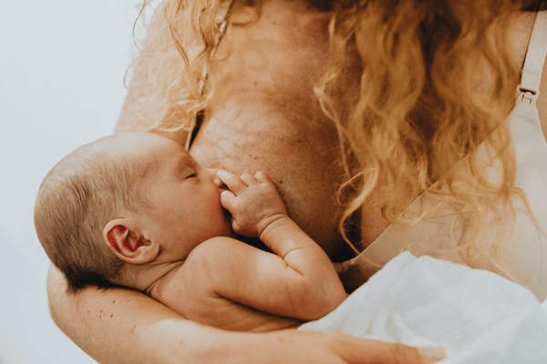 A breastfeeding mother and baby